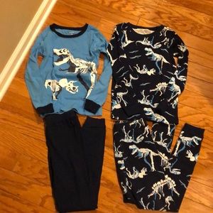 LIKE NEW 2 sets of slim fit carters Dino pjs